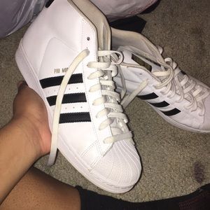 high top adidas shell toes